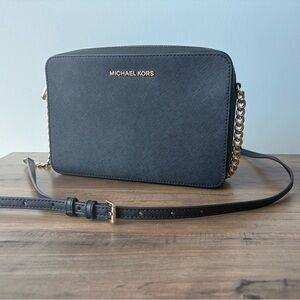 Michael Kors Elegant Black Crossbody Bag with Gold Accents